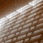 sepia photography of Hyatt Regency Atrium with dappled sunlight and hanging holiday lights